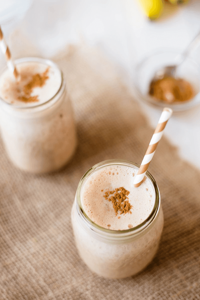 A photo of 2 individual and plated Chocolate Peanut Butter Shake in cups.
