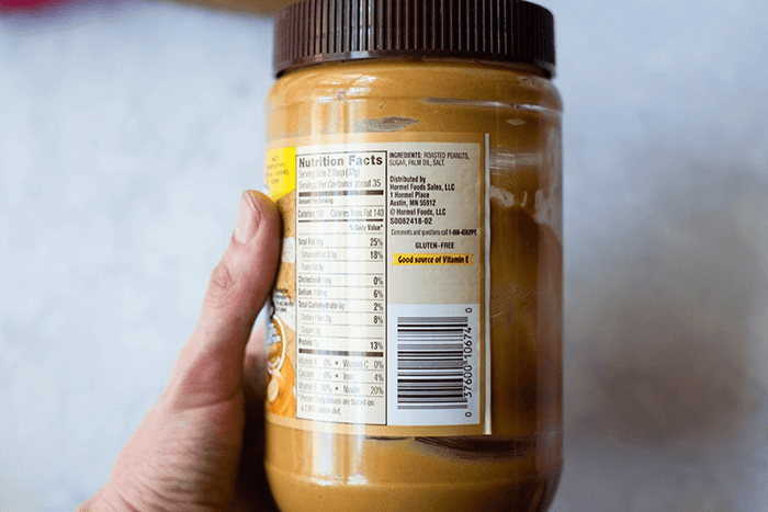 A photo of a peanut butter container showing the nutrition label.