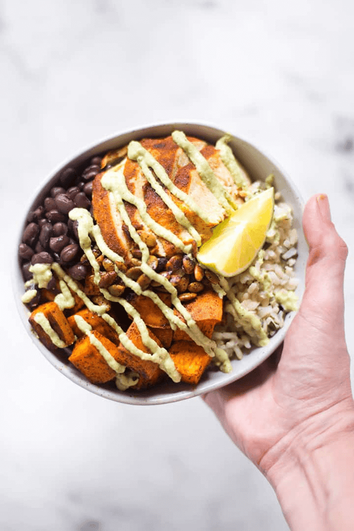 A photo of high protein chicken bowl in a white bowl.