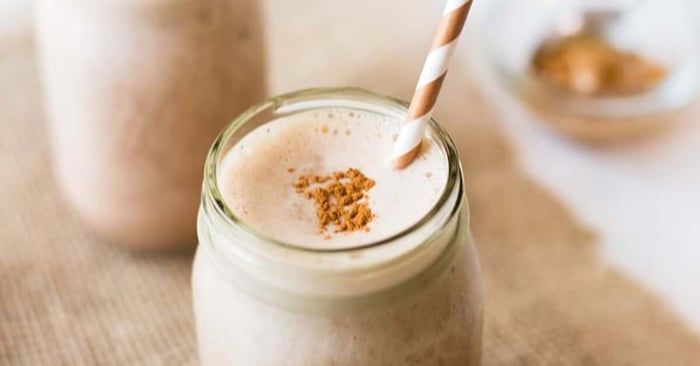 Finished version of Chocolate Peanut Butter Shake with a spoon scooping peanut butter in the back.