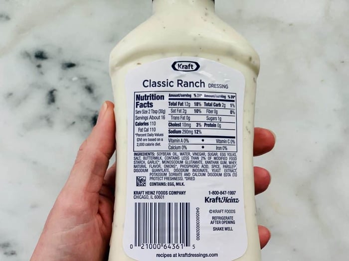Overhead view of the label of a bottle of salad dressing which contains MSG, one of the 10 Foods That Cause Inflammation.