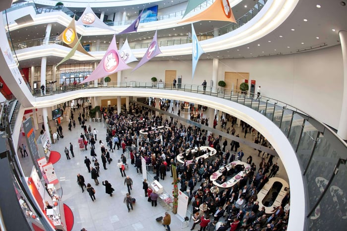 Large crowd of people gathered at a collectibles conventions.