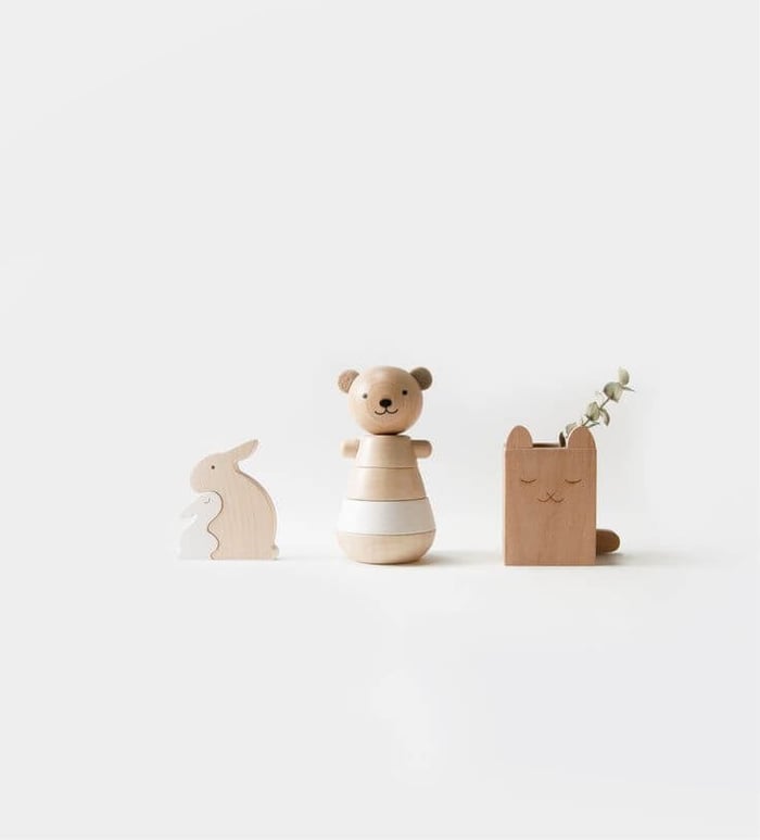 Three minimalist toy designs of wooden animals