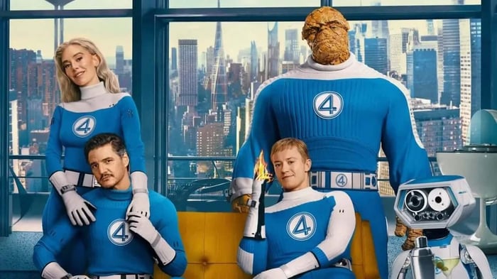 Fantastic Four in retro 1960s room with HERBIE robot, wearing classic blue suits from the MCU’s First Steps film.