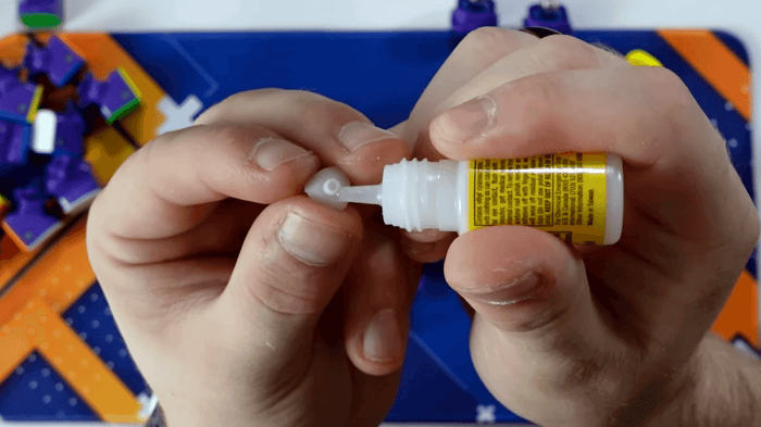 Applying glue to the corner magnets