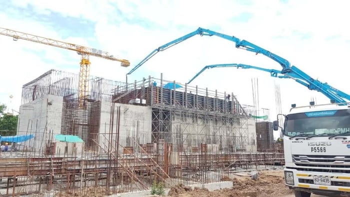 A construction site with cranesDescription automatically generated