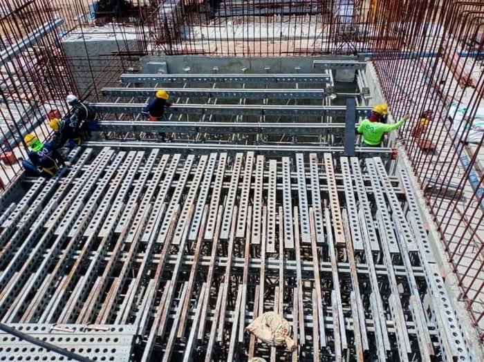 A group of people working on a construction siteDescription automatically generated