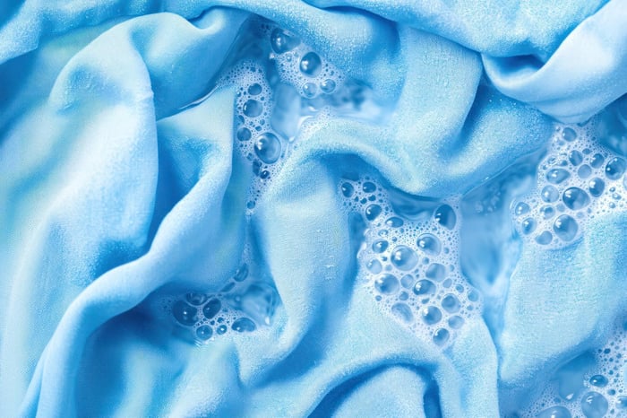 Cotton shirt soaking in water illustrating high water use compared to Tencel in is Tencel fabric toxic debate