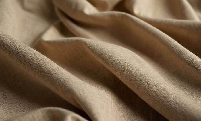 Close-up texture of an organic cotton sustainable sweater in neutral tones