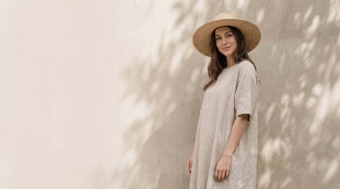 Woman wearing eco-friendly fair trade women's clothing featuring minimalist design, sustainable fabrics, and ethically produced garments for conscious everyday fashion.