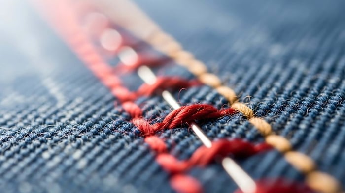 Close-up of durable stitching on good workout pants designed for long-lasting performance and active movement.