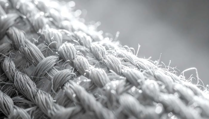 Close-up photo of natural textile fibers highlighting the texture and quality of healthy fabric materials