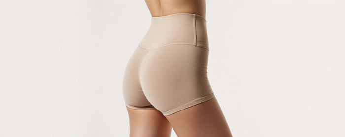 Model wearing high-waisted ladies workout bottoms designed for comfort, support, and performance
