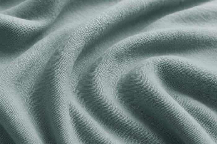 Macro shot of TENCEL™ lyocell fibers, showcasing the smooth, breathable material used in sustainable sweatpants