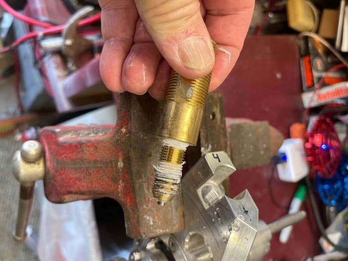 Brass fitting removed from brush with jet visible