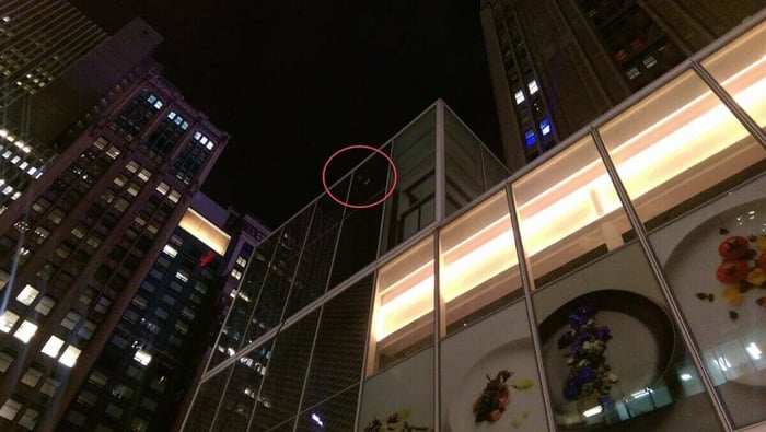 Doug Apt demonstrating a 63-foot Gardiner SuperMax 3K water fed pole cleaning a building in New York City at night