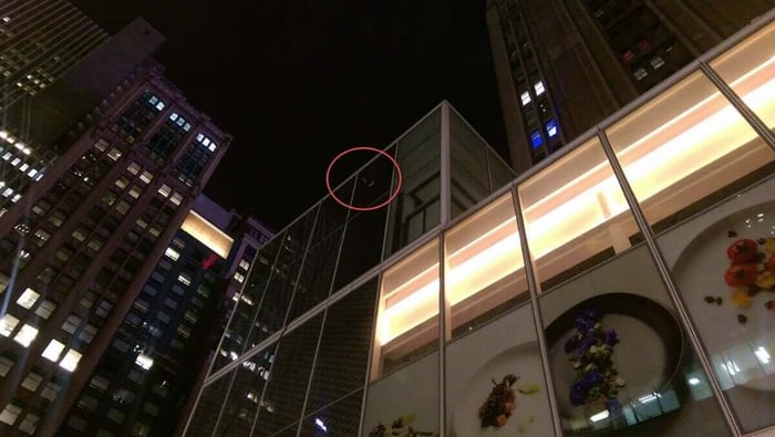 Doug Apt demonstrating a 63-foot Gardiner SuperMax 3K water fed pole cleaning a building in New York City at night