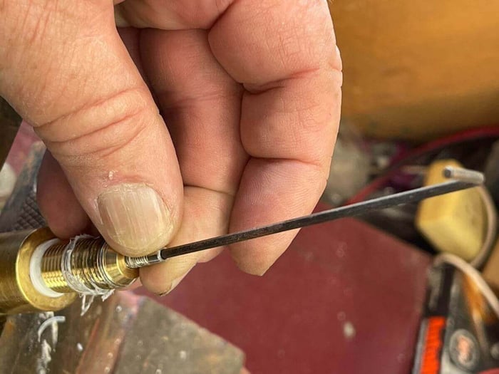 Re-installing the cleared jet into the brass fitting