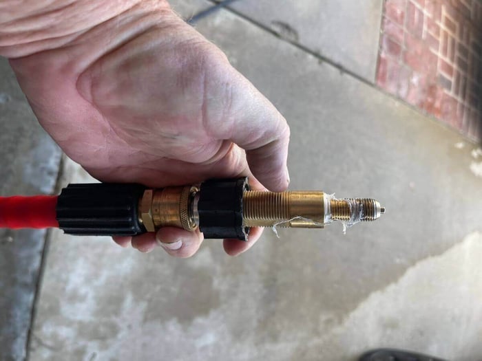 Attaching the M22 fitting to a water source for a bench test