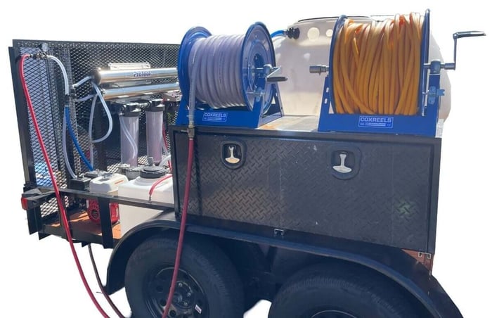 Hose connections and buffer tank on drone cleaning trailer