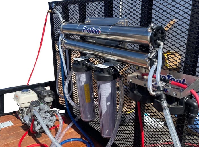 Dual high-flow RO membranes inside drone cleaning trailer