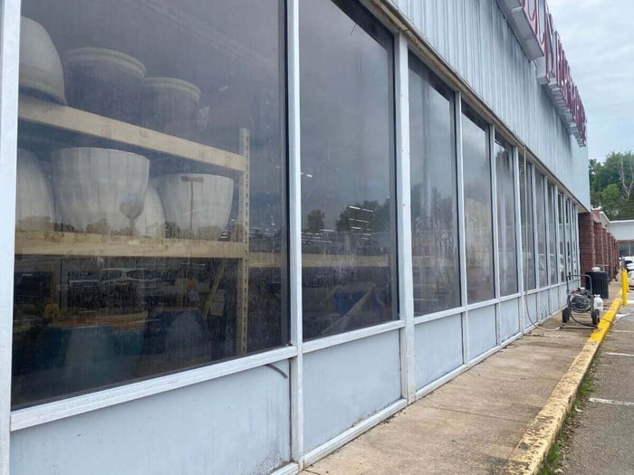 Close-up of building surface before Restore All cleaning
