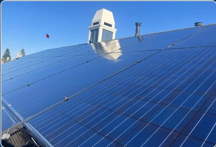 solar-clean-panels-on-roof-from-side-a-Vj6cc3.jpg