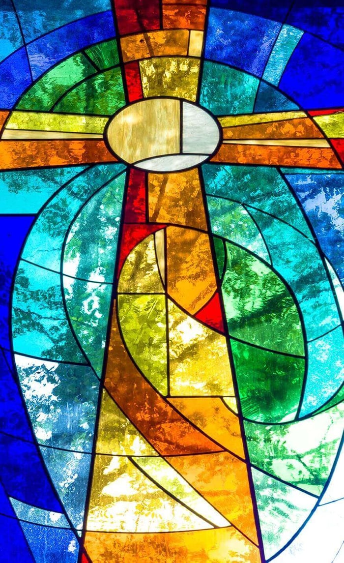 Close-up of a stained glass window showing lead came joints between colored panes