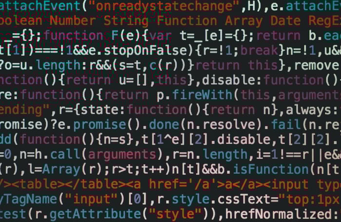 Close-up of colorful coding text on a dark computer screen, representing software development.