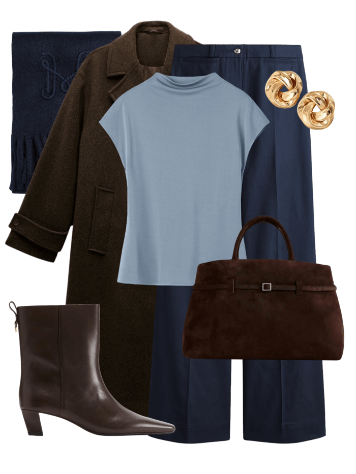 Brown wool coat styled with navy trousers and light blue knit — brown is the new black in quiet luxury layering.