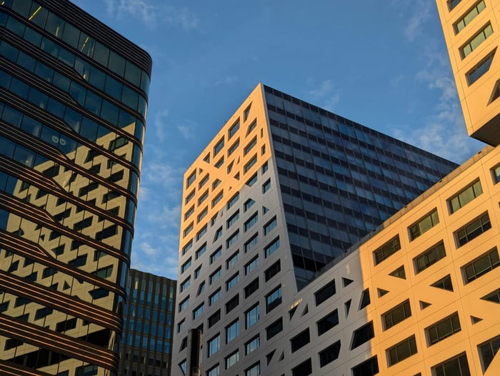 Explore Utrecht's modern skyline against a vibrant sunset, capturing urban architecture at its best.