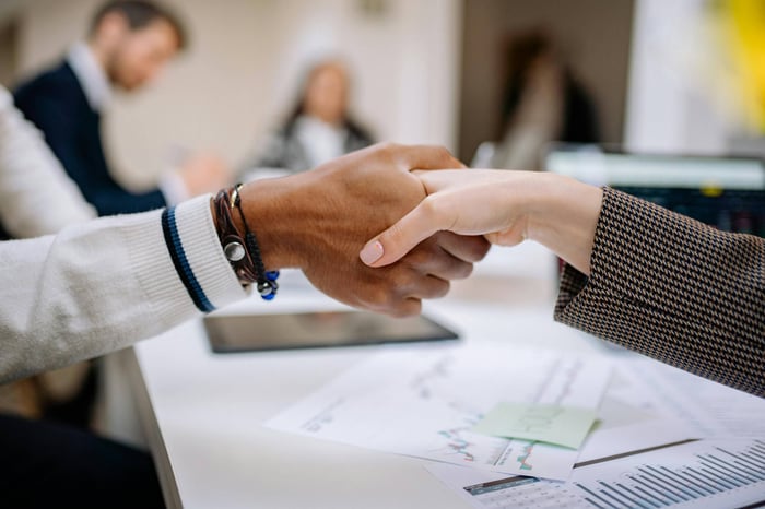 consultants collaborating with an in-house marketing team on AI-driven outbound strategy