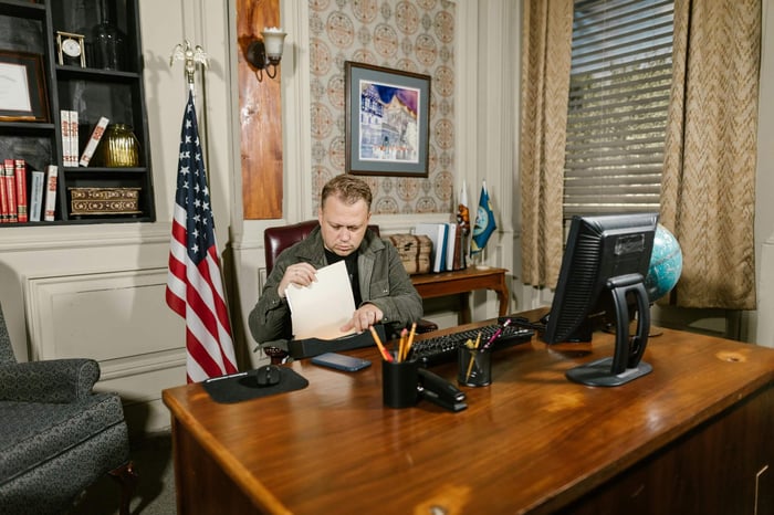 private equity professional reviewing a multi-channel outbound sequence on a CRM dashboard, optimizing follow-up stages