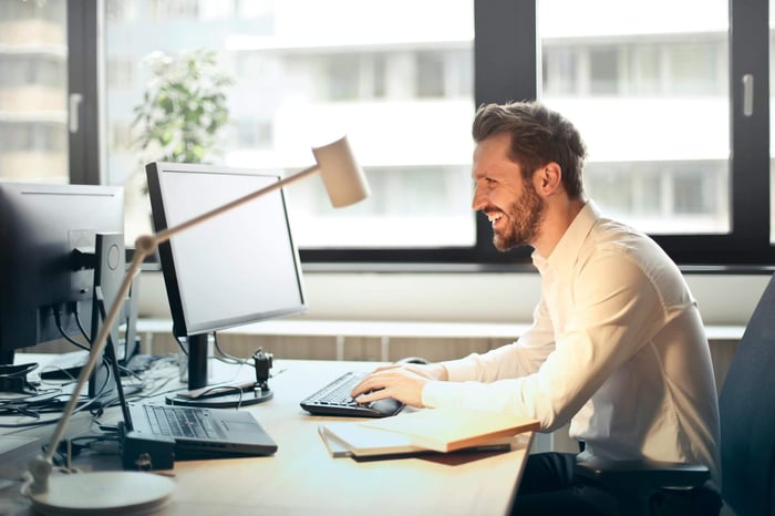 person crafting personalized cold email messages based on prospect research and industry insights