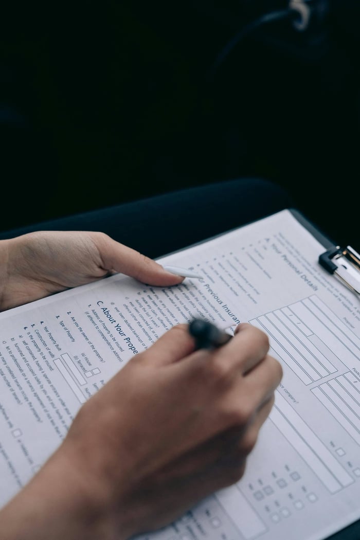 private equity team looking at a spreadsheet filled with data, illustrating the limitations of manual deal sourcing and its compounding bottlenecks