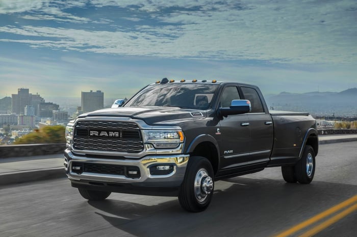 Black Ram truck, driving on highway, with 20 mpg city/25 mpg highway fuel economy.