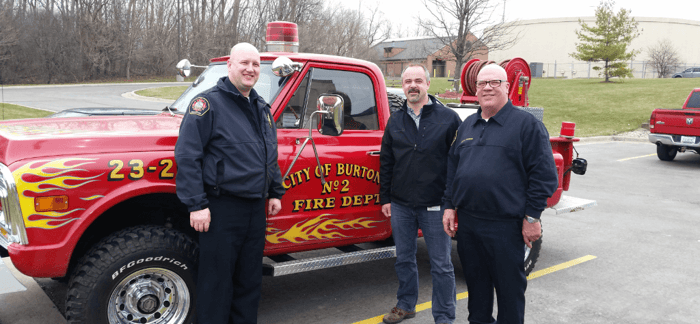 Tony Powell fire truck with firefighters image