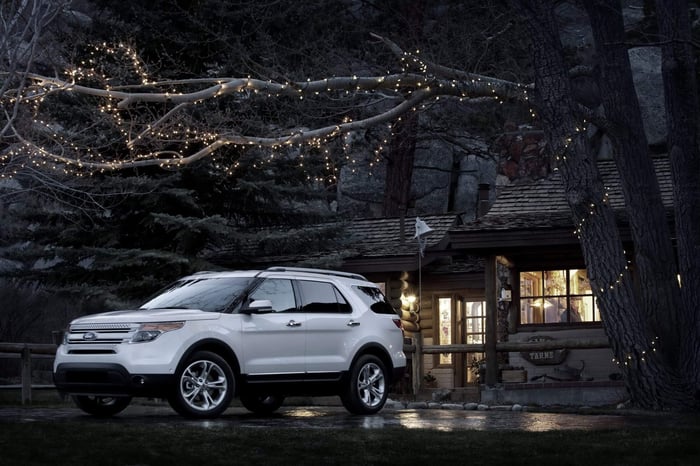 White vehicle with aftermarket accessories and trailer tow package, which you can consider taking for a test drive.