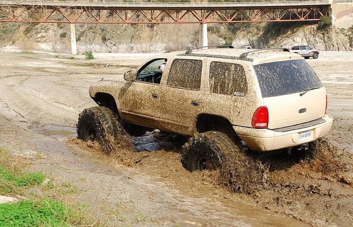 1999 Dodge Durango, one of the Dodge Durango years to avoid, with low owner satisfaction, driving in the mud.