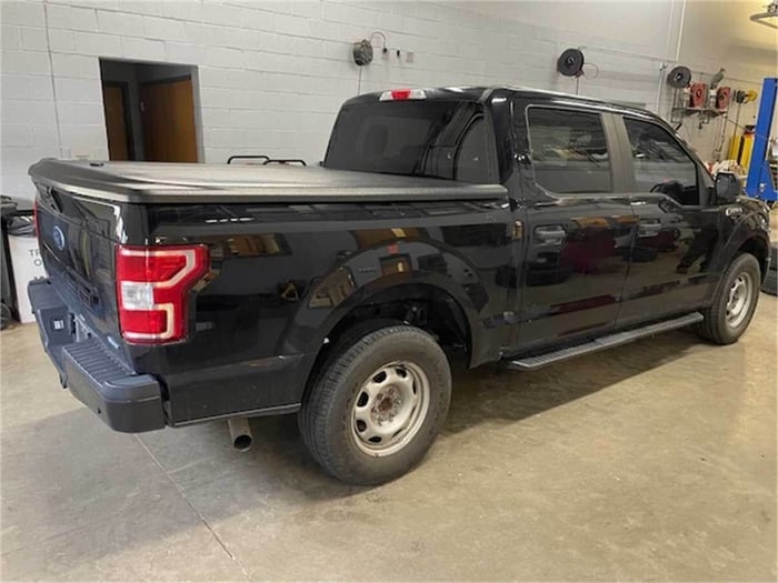 Black Ford F 150 for sale on Municibid, with standard width bed in the back (96 inches long) to haul your stuff and standard specs.