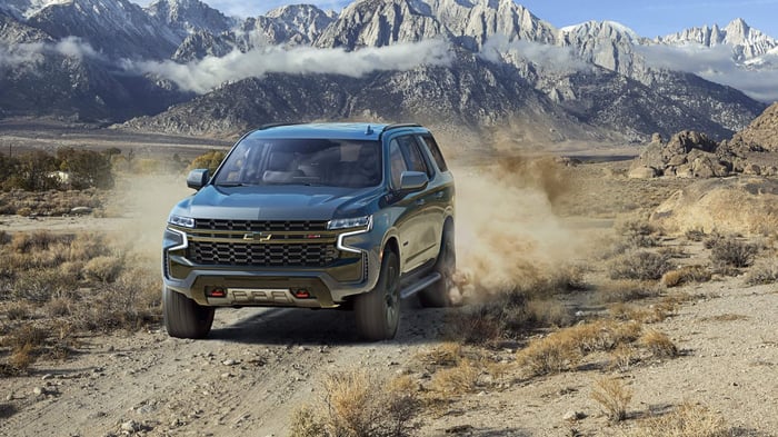 Fuel efficient, grey Chevy Tahoe with adaptive cruise control, which can seat up to nine passengers.