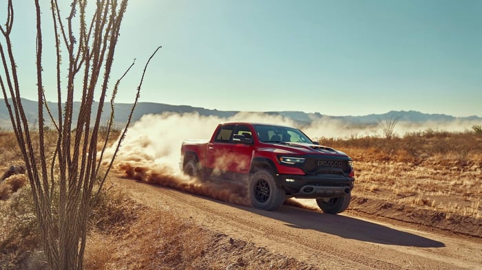 Red Ram truck, one of the most reliable on the market today, driving down a dusty road.