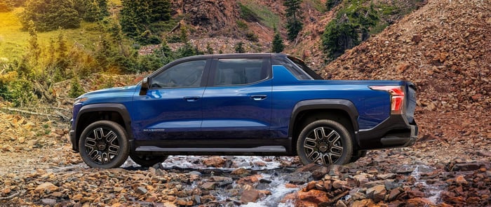 2024 Chevy Silverado EV with adaptive cruise control, variety of turbodiesel engine options, crew cab, four wheel drive option, various bed length options, and smoother ride quality, however it may experience body roll.
