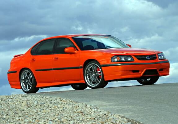 2003 Orange Chevy Impala, with reliability score of 4/5 and average annual maintenance costs of $400 to $600.