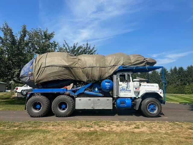 Another Lingo fleet truck transporting landscaping materials to a worksite.