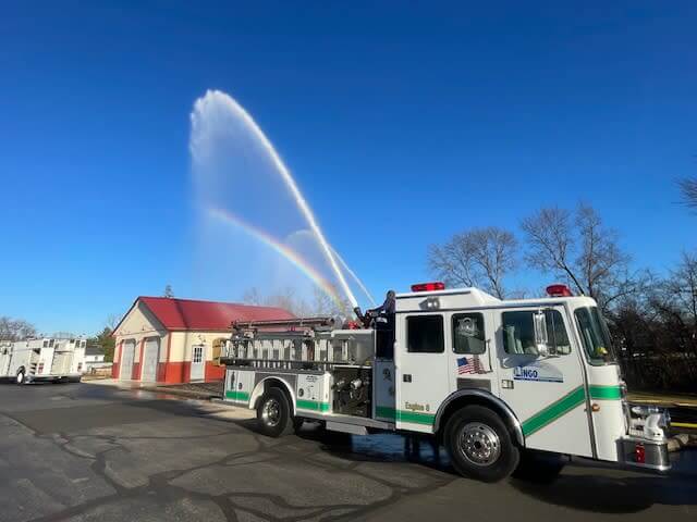The Lingo Group in the community with a fire truck.