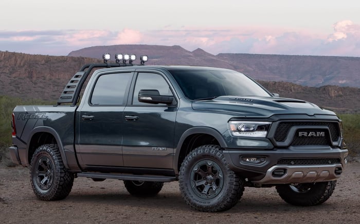 2018 Ram, Rebel Smoke concept, on a gravel road with hills in the background.