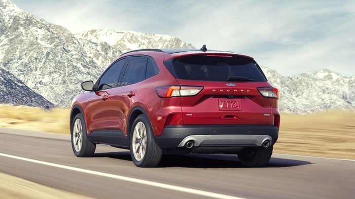 Red Ford Escape with selectable drive modes and trailer tow package, with max towing capacity of 1,500 to 3,500 pounds.