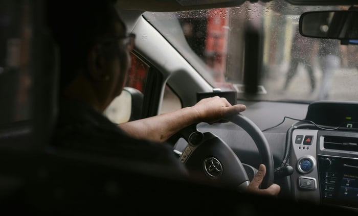 Man test driving a car.