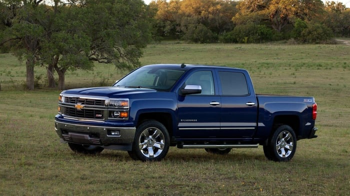 Dark blue Chevy Silverado with an upper trim package and crew cab, a true pickup truck and convenient family hauler providing a comfortable ride.